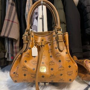 MCM Shoulder Bag with String! M size for all your needs . clean and stain free.